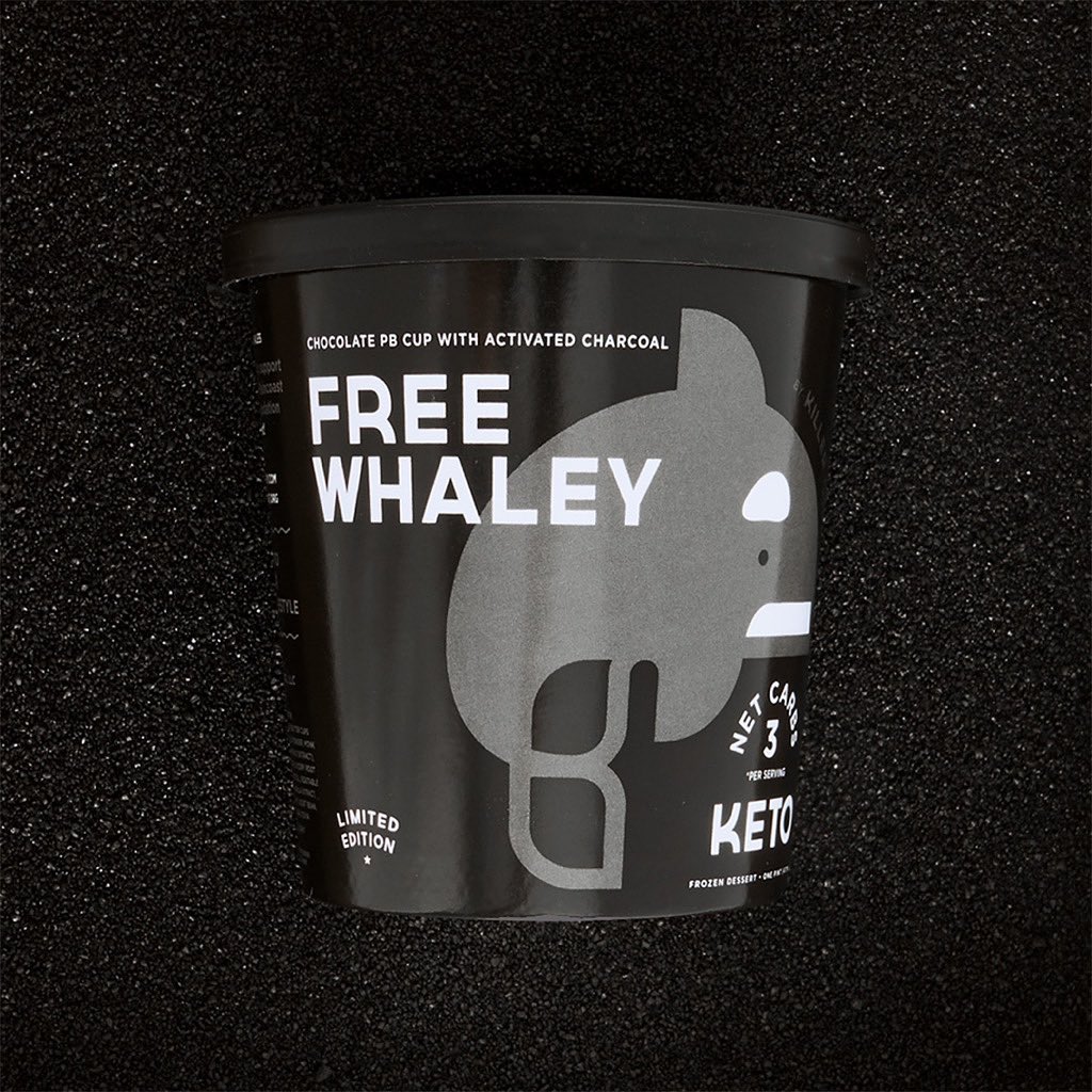 A black icecream tub with an orca on it reads "Free Whaley" on a black backdrop.