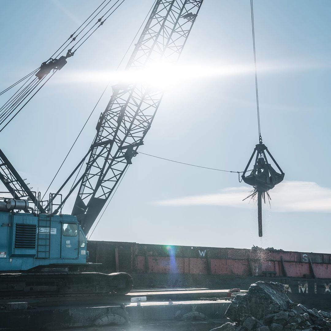 Crane works at dredging Fraser River Estuary